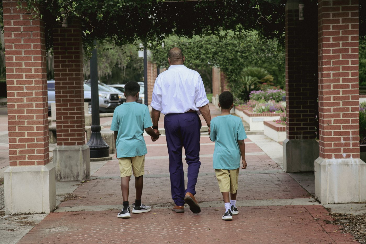 Donald Sipp Jr. walking with his two sons